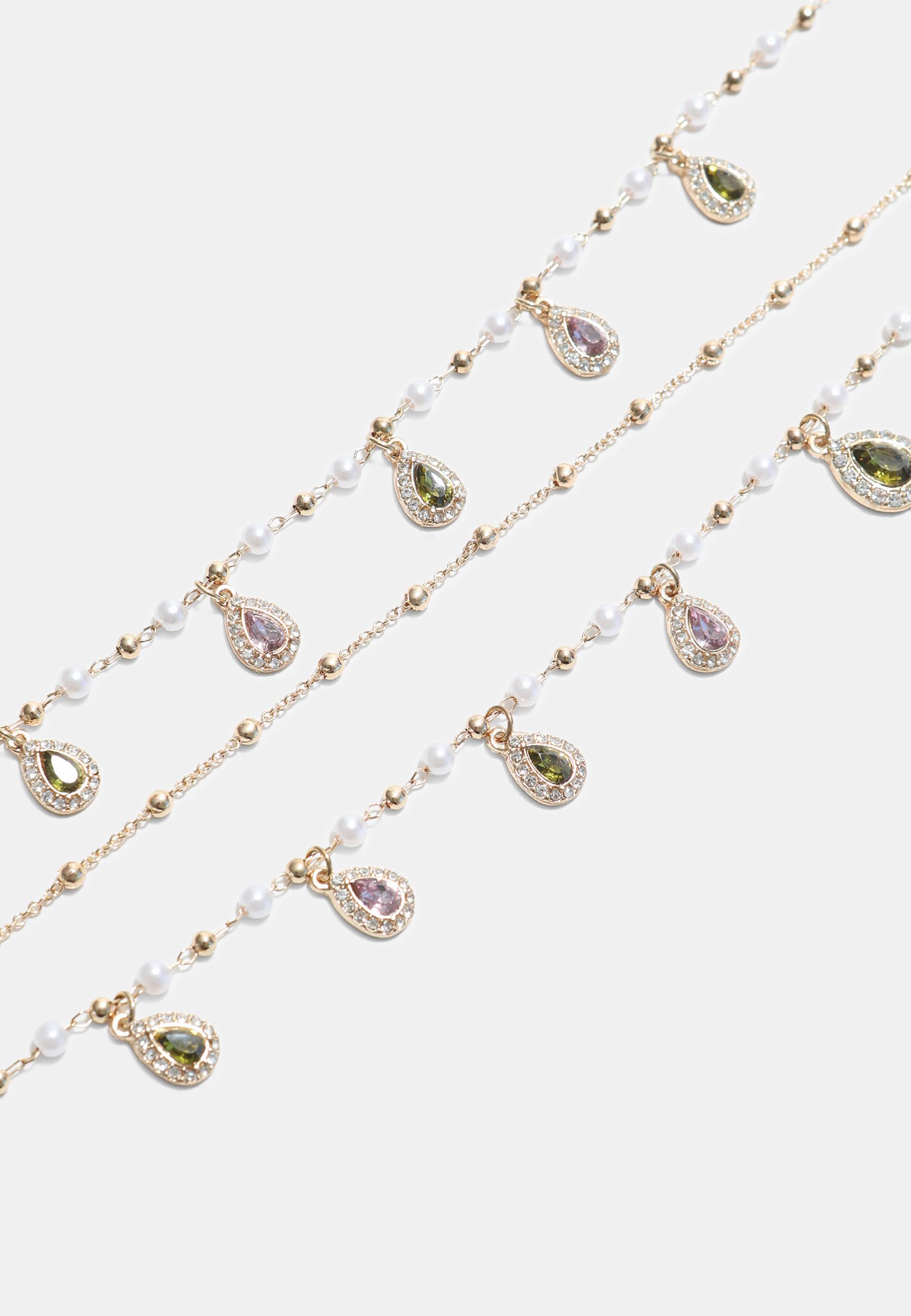 Long multi-charm necklace — Gold