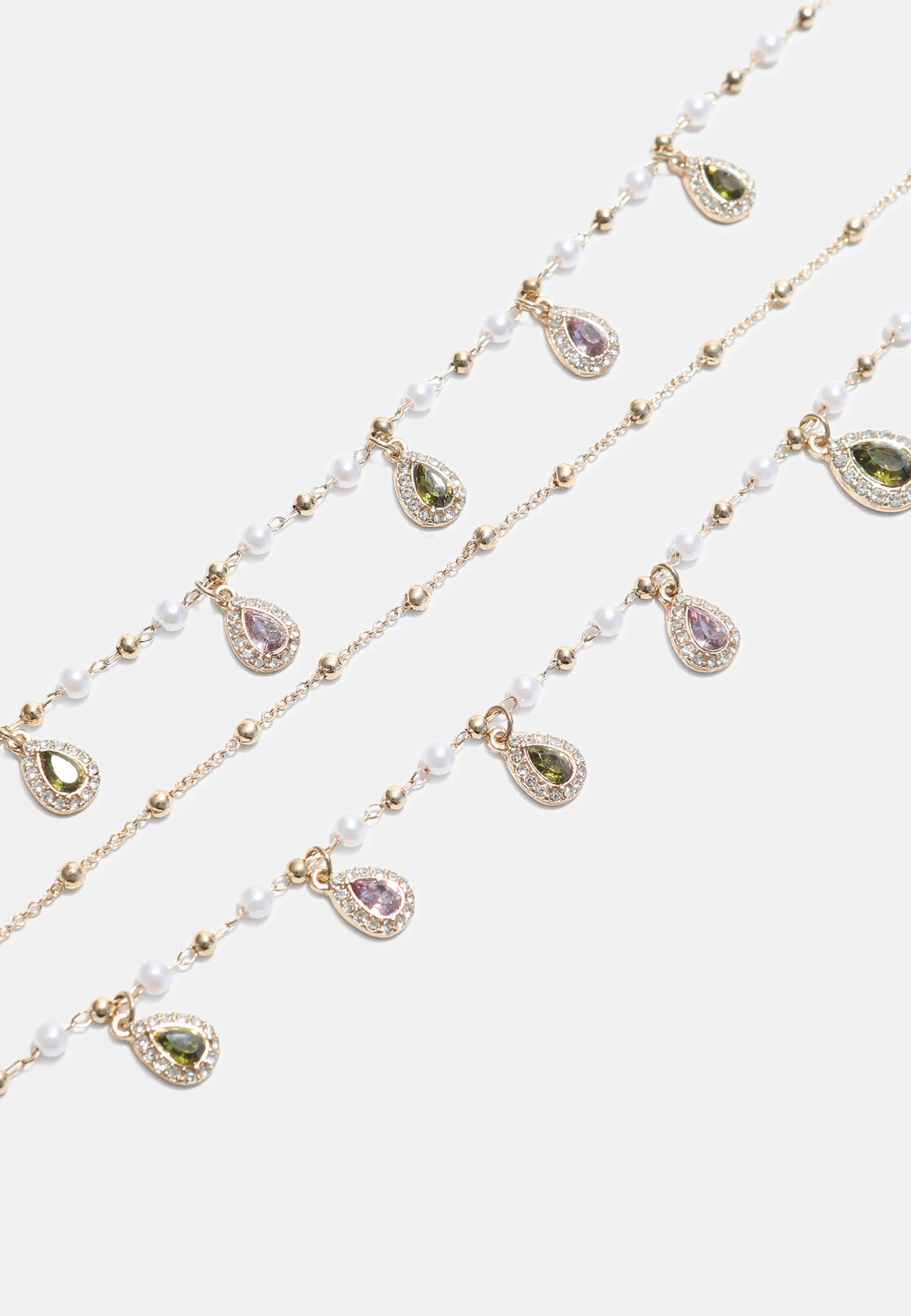 Long multi-charm necklace — Gold