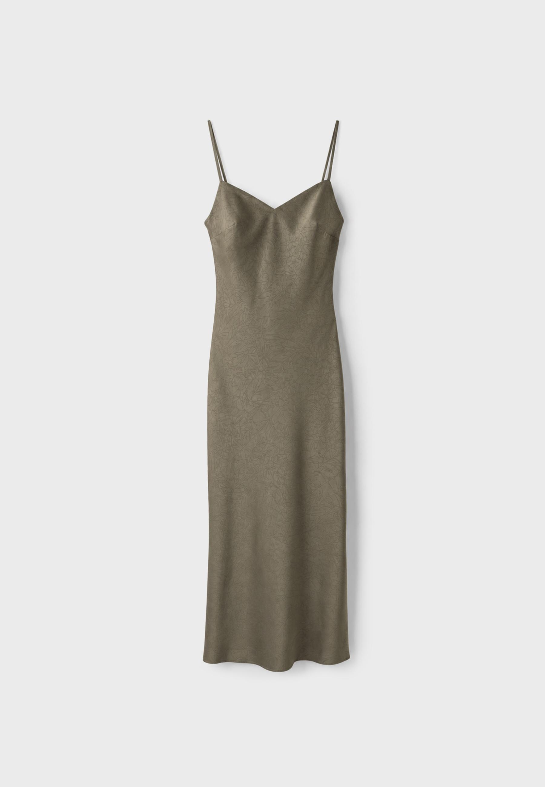 Front view of a khaki midi dress with a V-neckline, spaghetti straps, and tonal floral motifs.