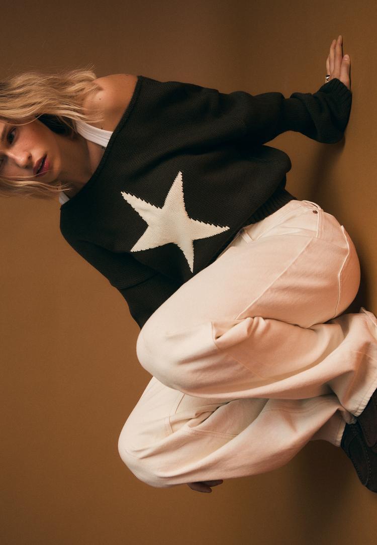 asymmetric knit sweater with star