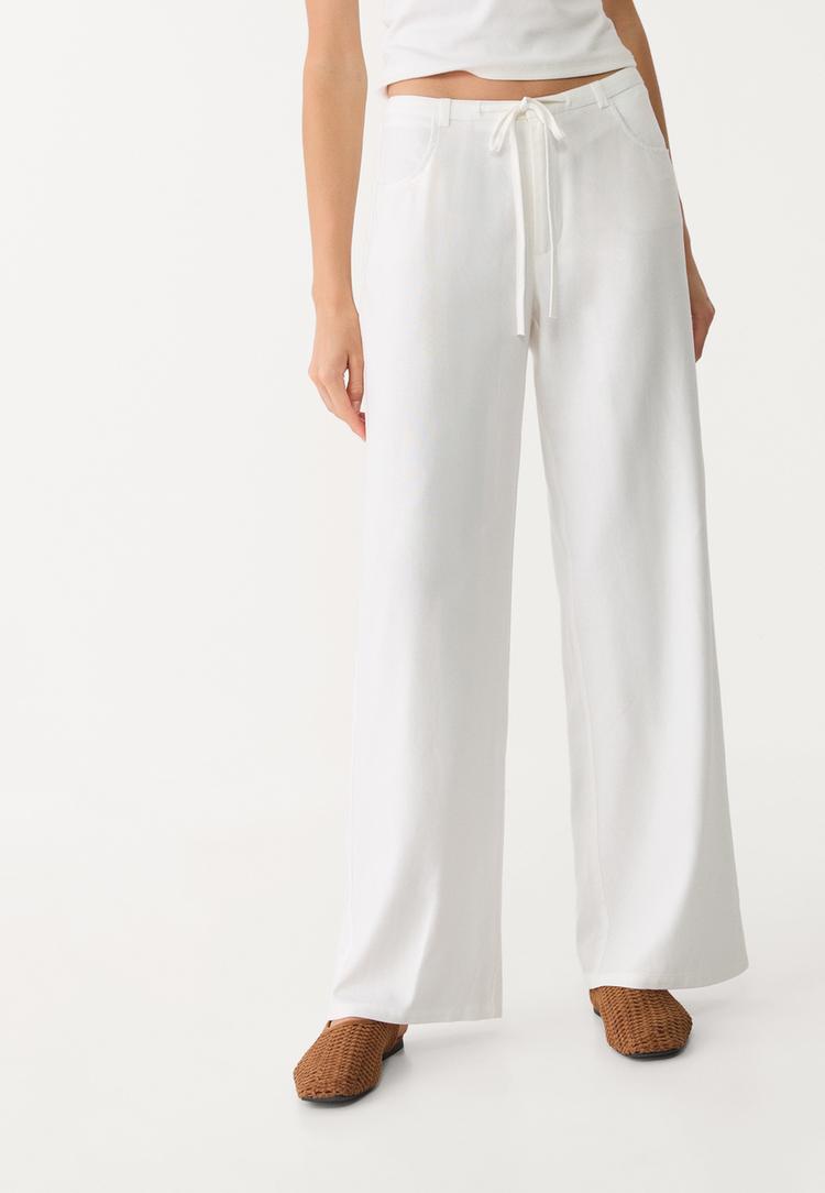 pantalon fluido bolsillos