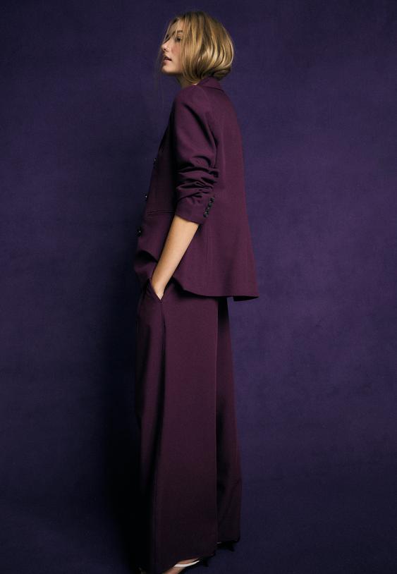 pantaloni eleganti wide leg con bottoni regolabili