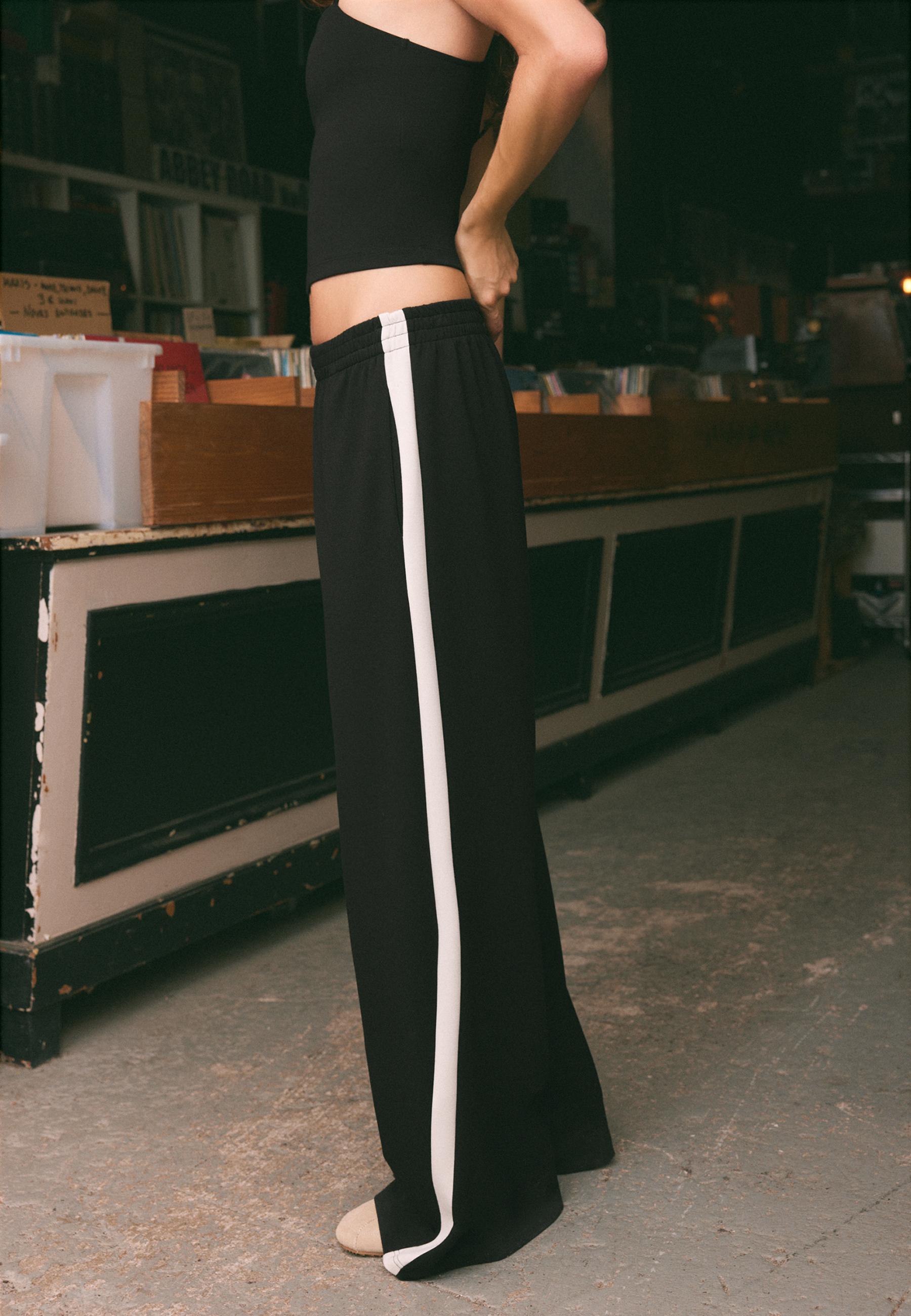 Soft-touch wide-leg jogger trousers with side band — Black