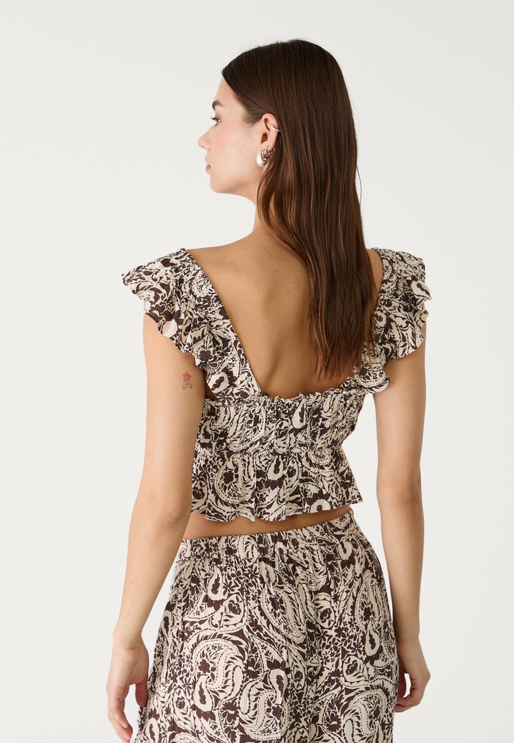 top fluido volantes estampado