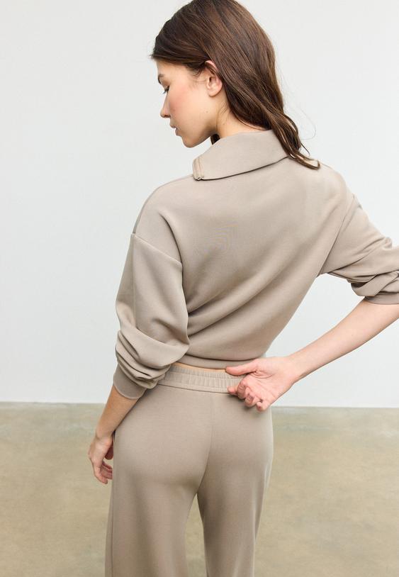 felpa con cerniera laterale effetto morbido