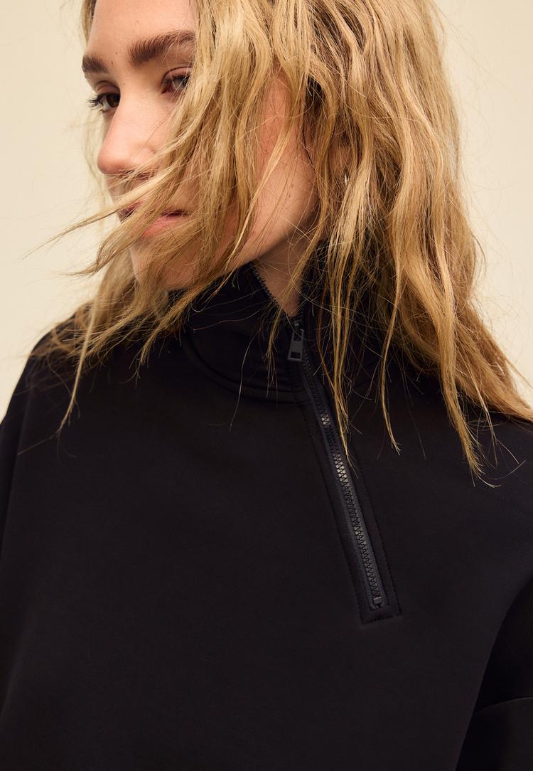 soft touch sweater met rits aan de zijkant