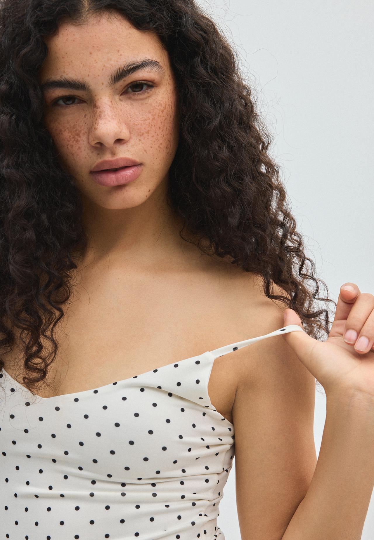 Polka dot V-neck bodysuit — Ecru