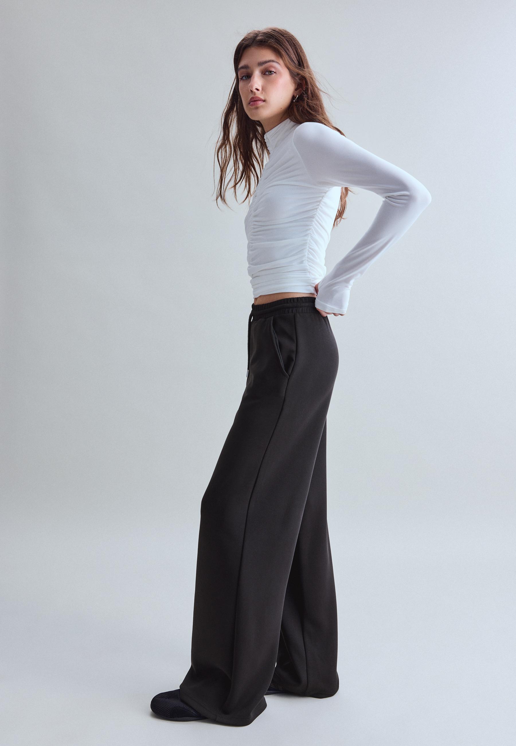 Soft-touch palazzo joggers — Black