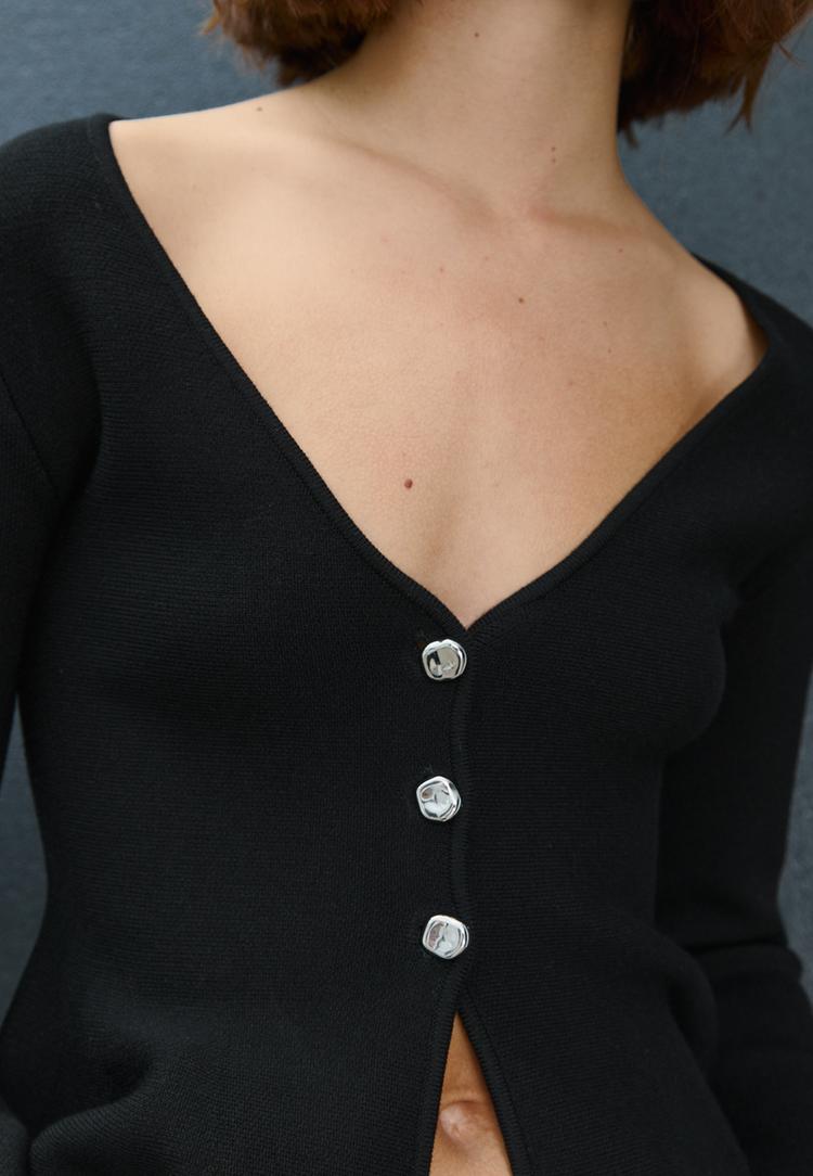 chaqueta peplum punto botones