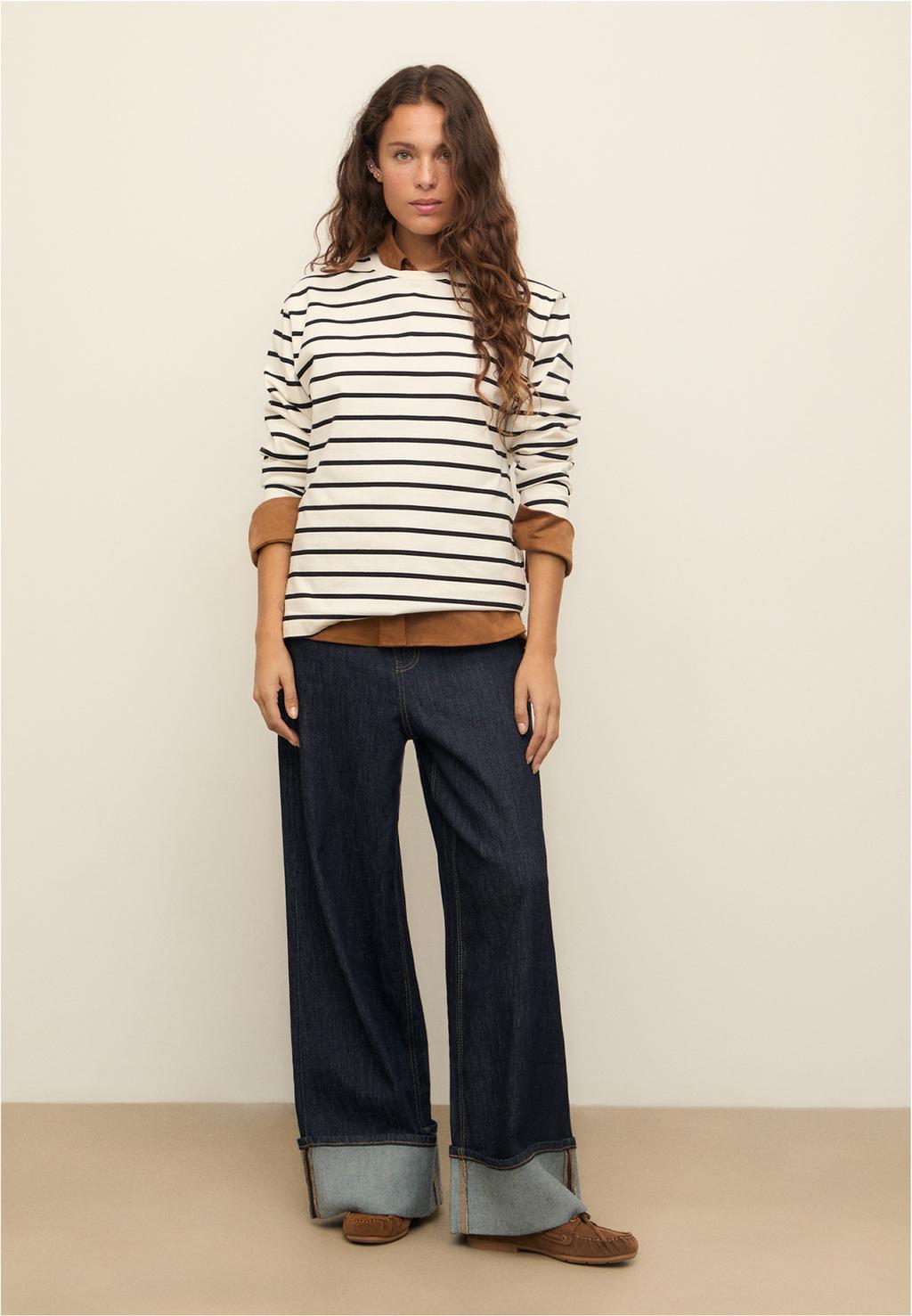 Jeans wide leg con dettaglio sull'orlo