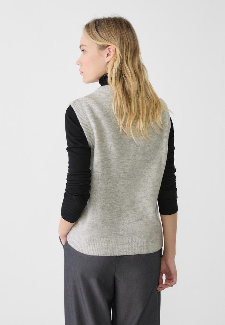 veste sans manches en maille a boutons