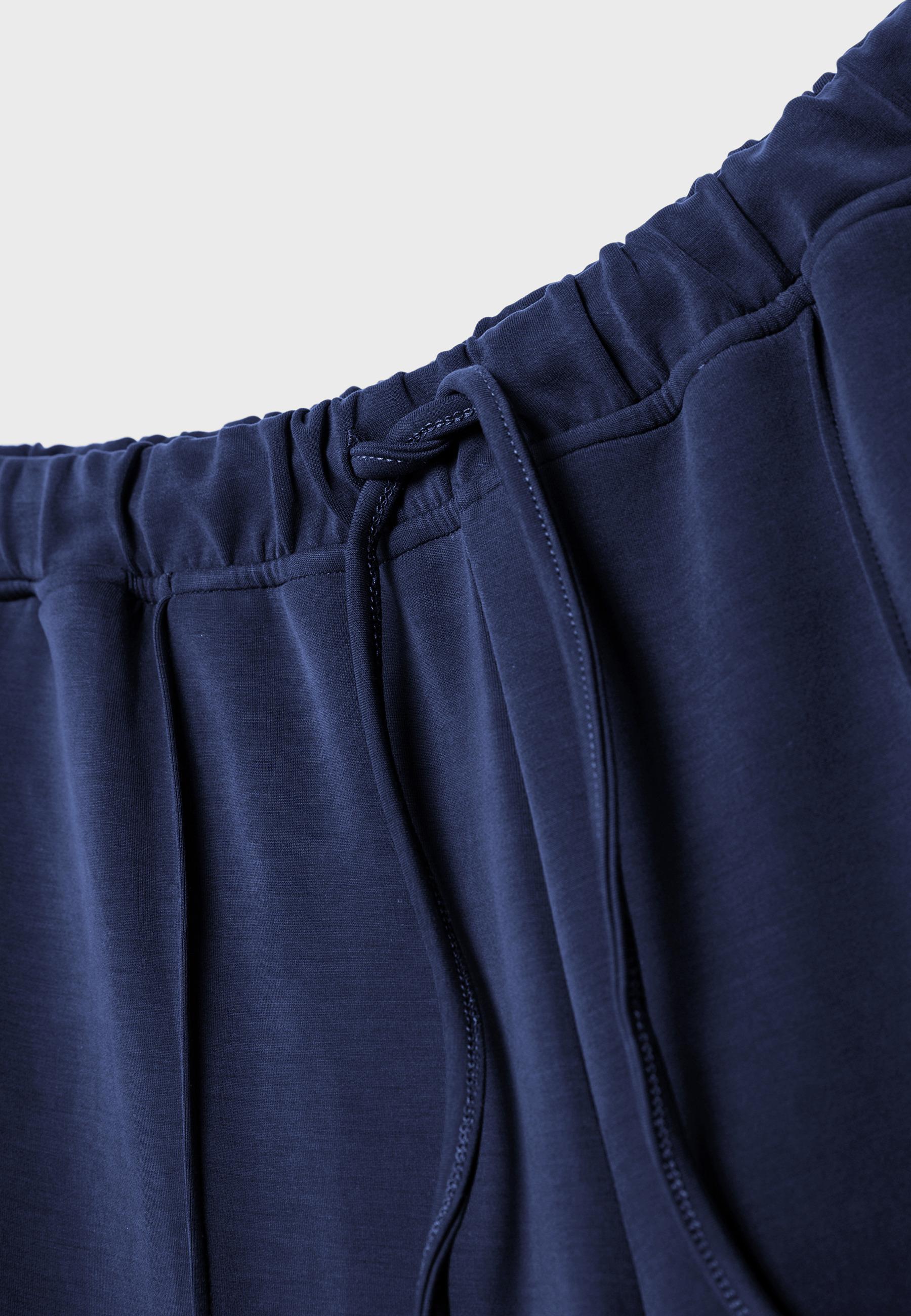 Soft-touch wide-leg pin-tuck joggers — Navy blue