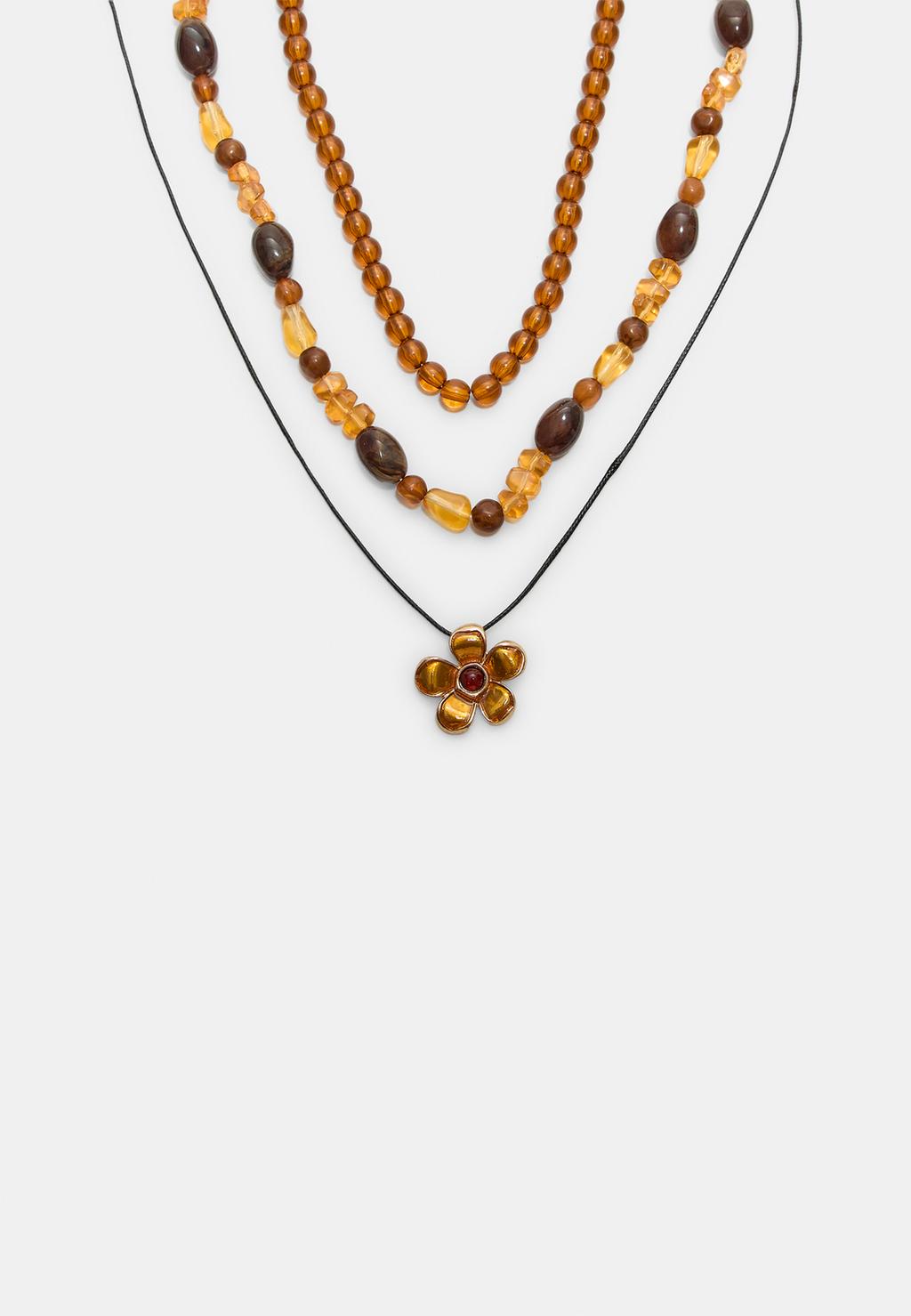 Set di 3 collane con perline e fiori