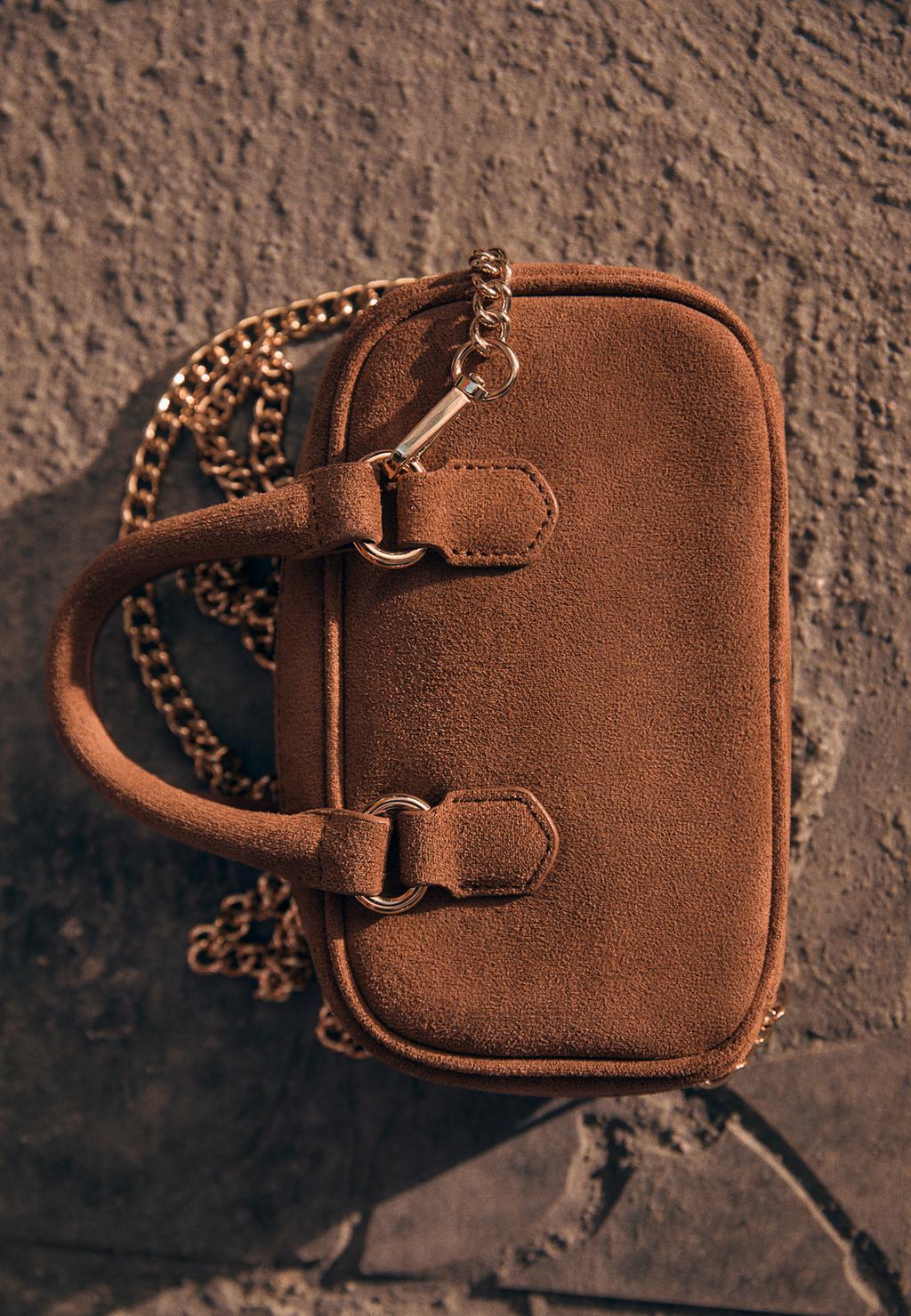 Faux suede mini crossbody bowling bag