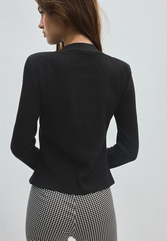 chaqueta punto hombreras