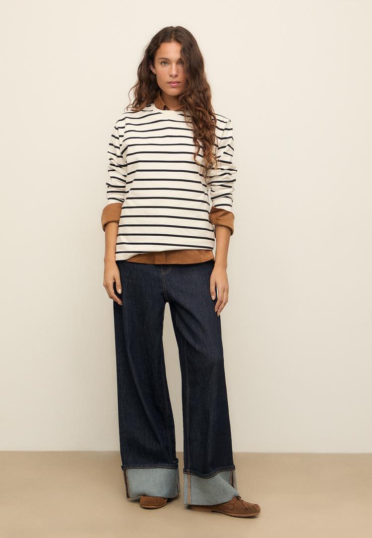 jeans wide leg detalle bajo