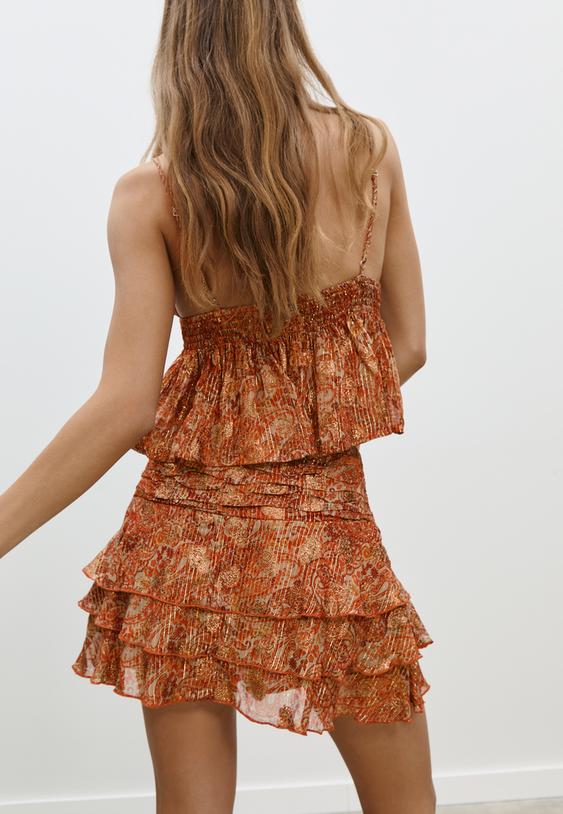 soepelvallende top met print en metallic draad