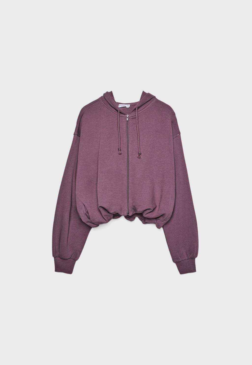 Sudadera abullonada capucha