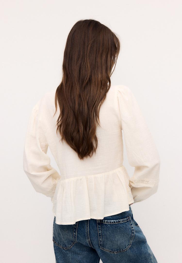 blusa fluida ricamata con nodo