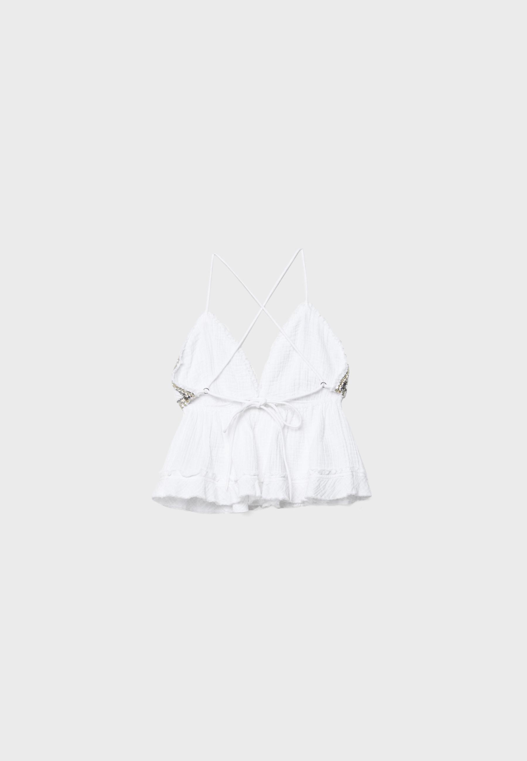 Ruffled and beaded top — Ecru