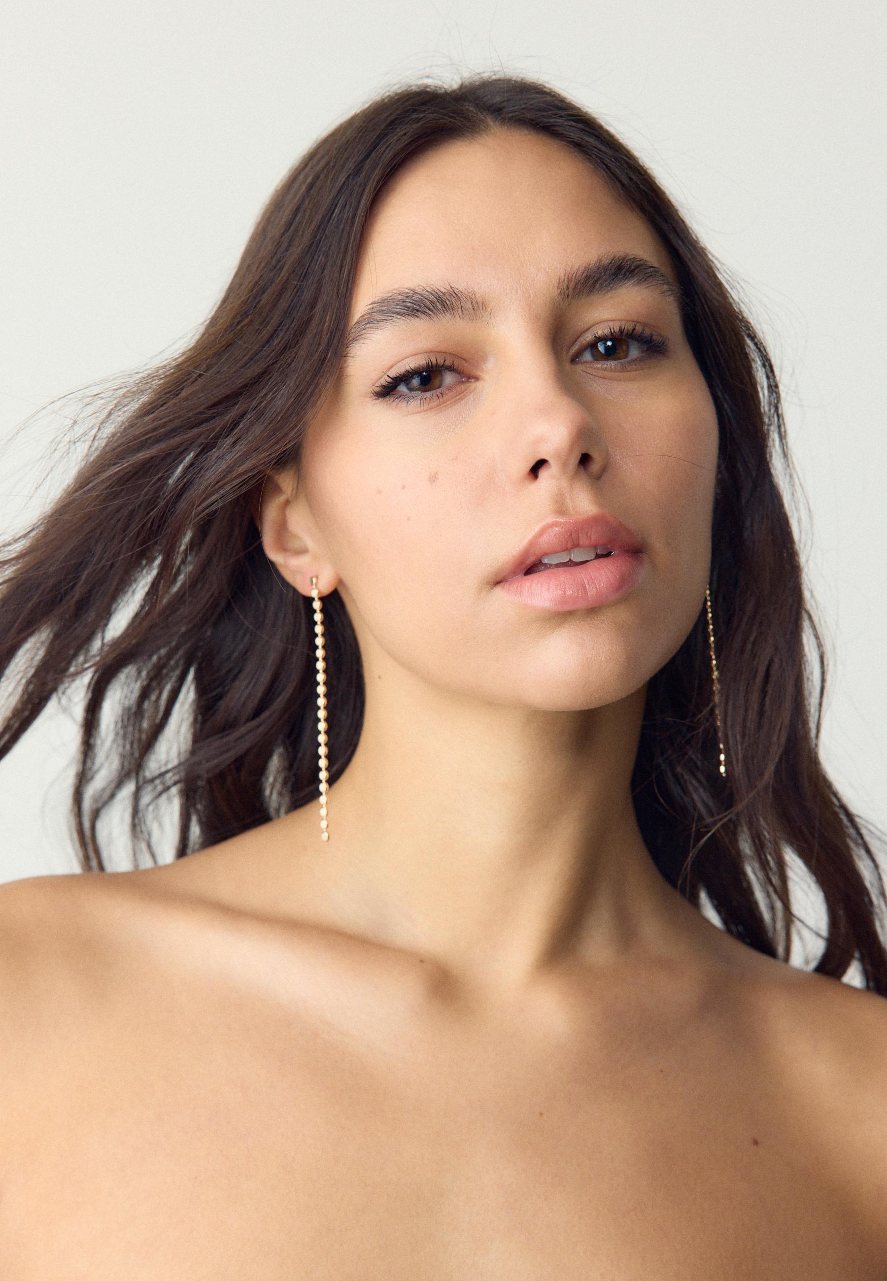 9-pack of ladybird earrings — Gold