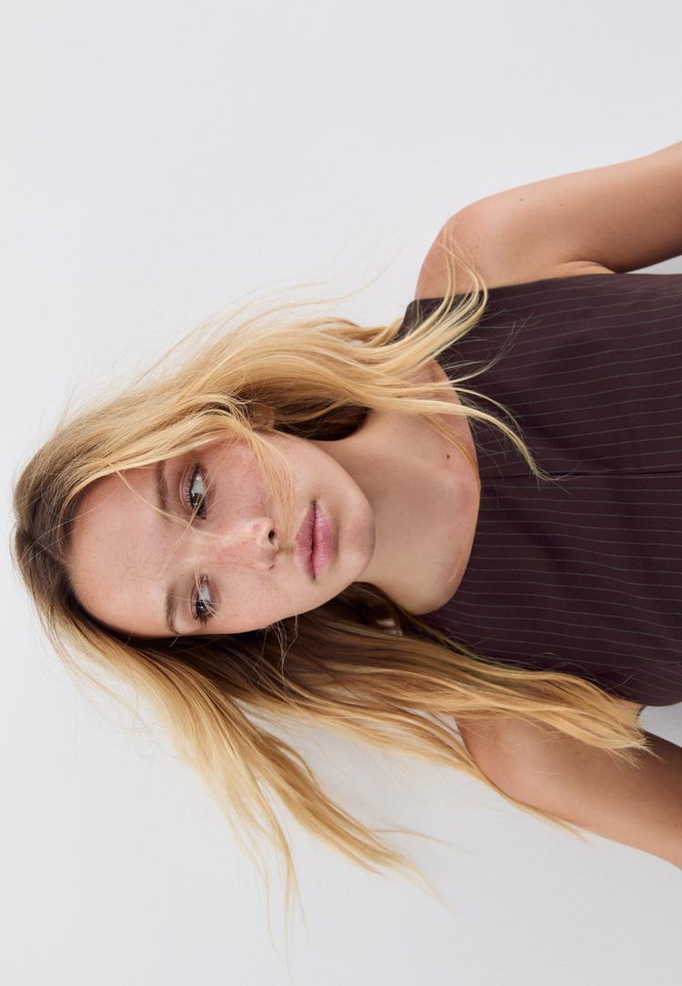 top peplum sin mangas rayas