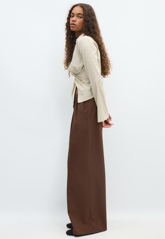 pantaloni eleganti wide leg con bottoni regolabili