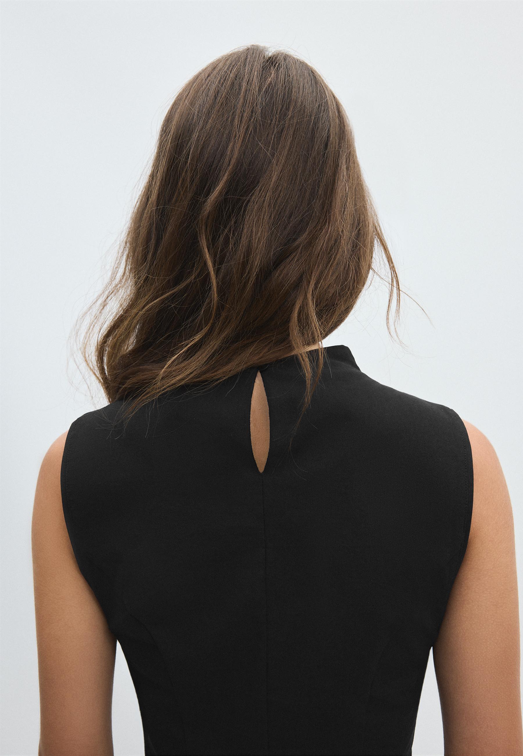 Sleeveless high-neck peplum top — Black