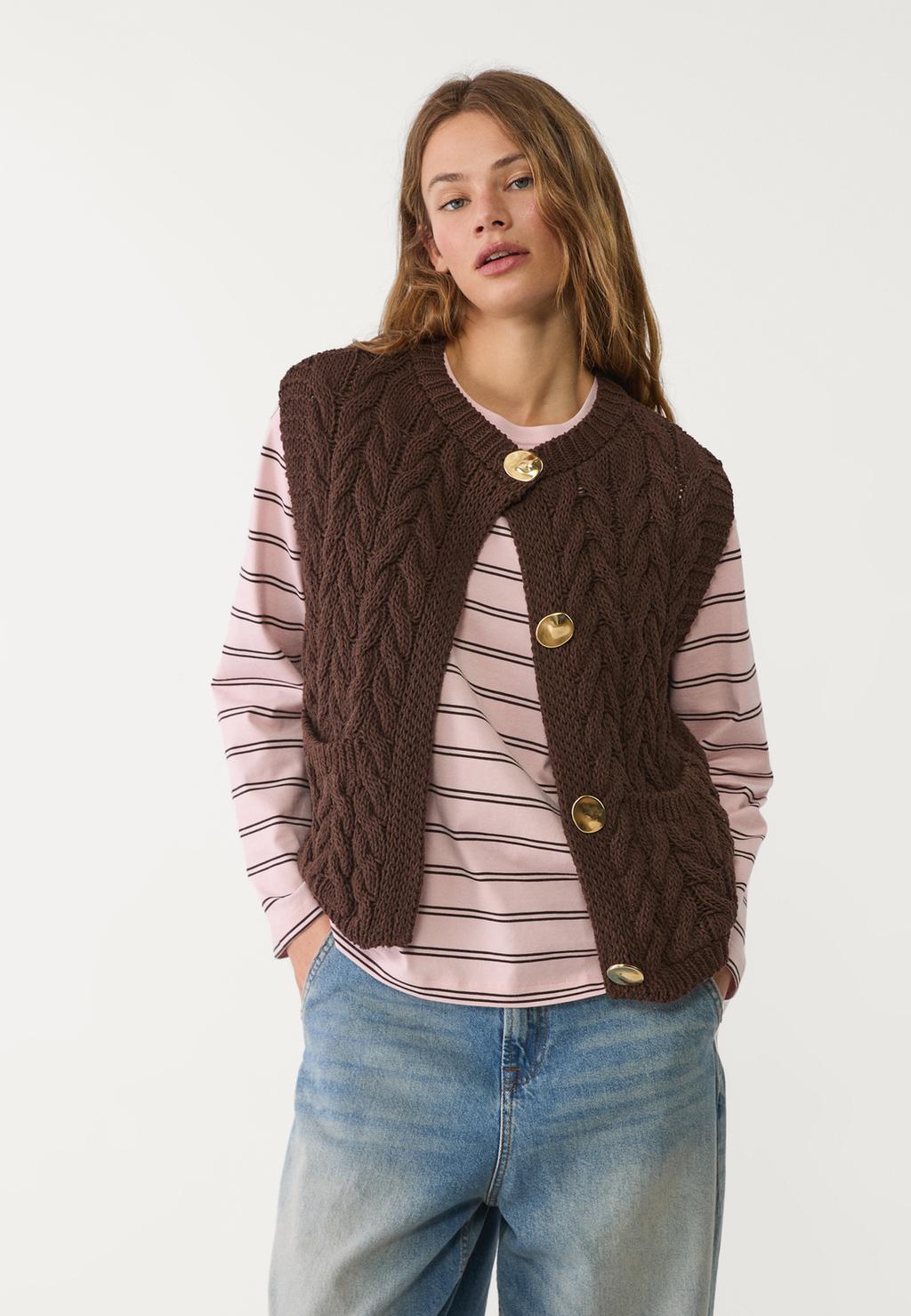 Cable-knit vest with golden buttons