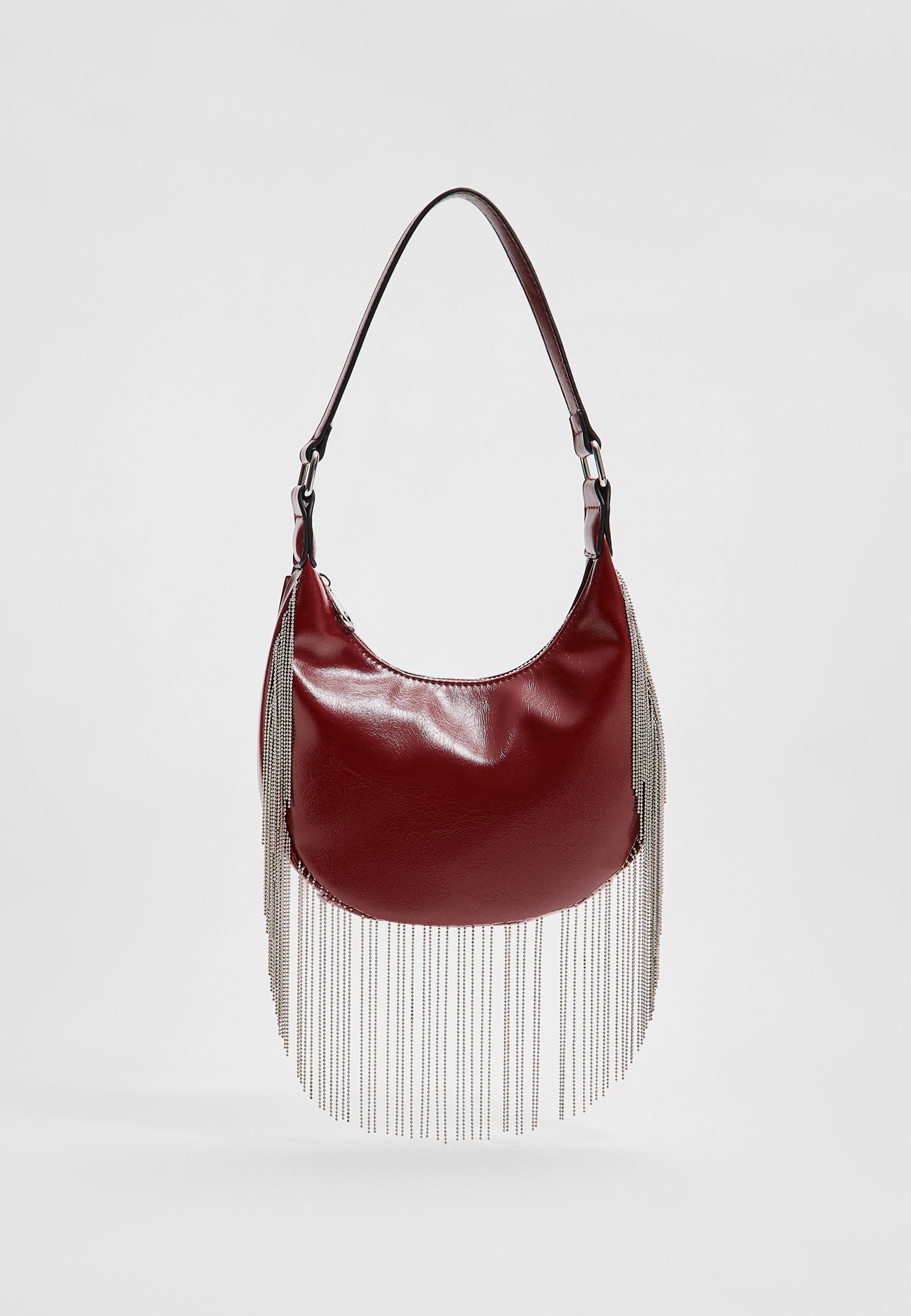 Shoulder bag with metal fringing