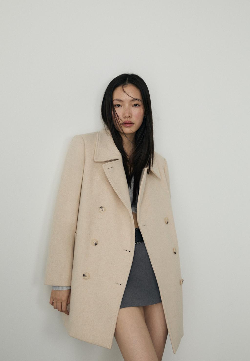 Coat with faux fur collar