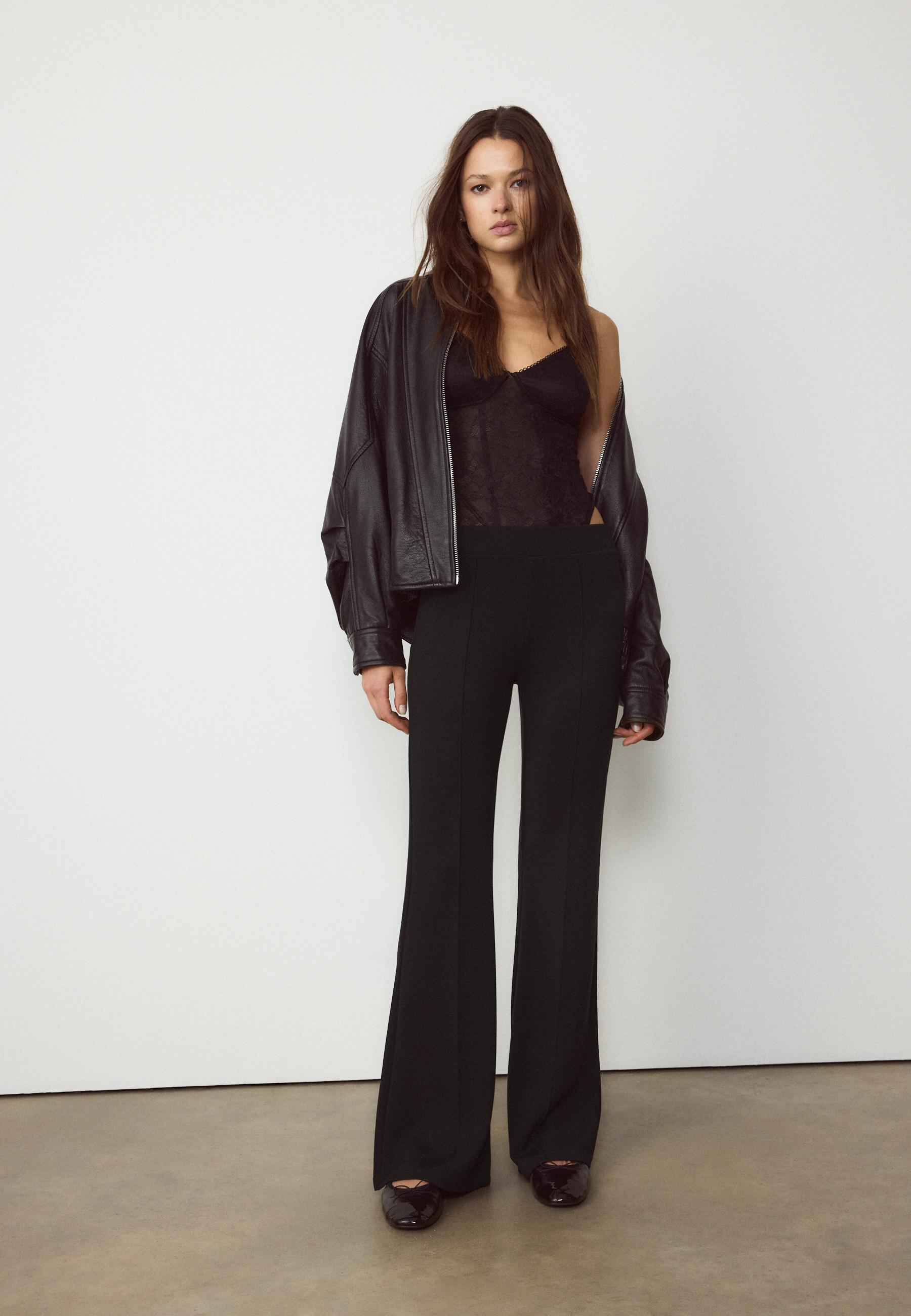 Soft-touch bell bottom trousers with front seam detail - Women's