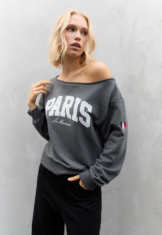 sudadera grafico hombro descubierto