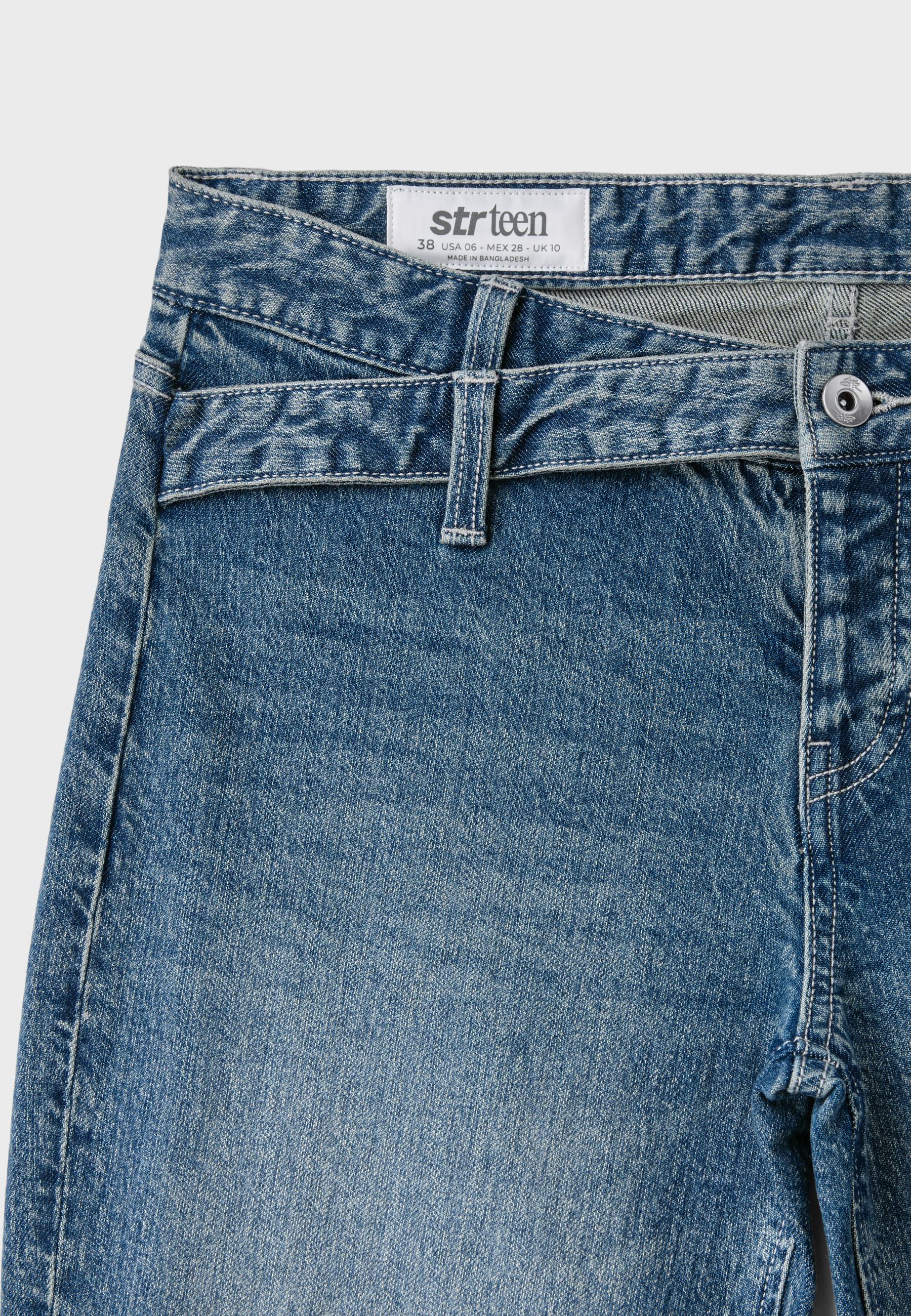 Crossover waistband bell bottom jeans — MEDIUM BLUE DENIM