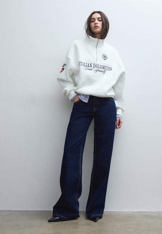 felpa con cerniera e ricami