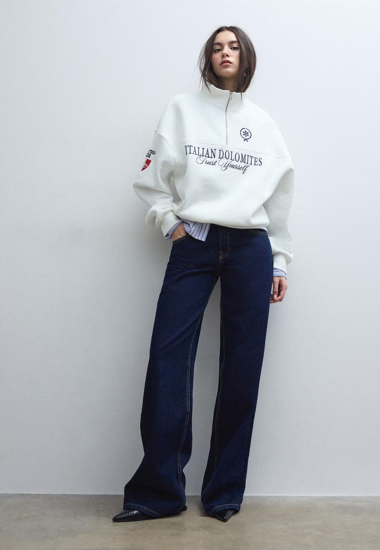 felpa con cerniera e ricami