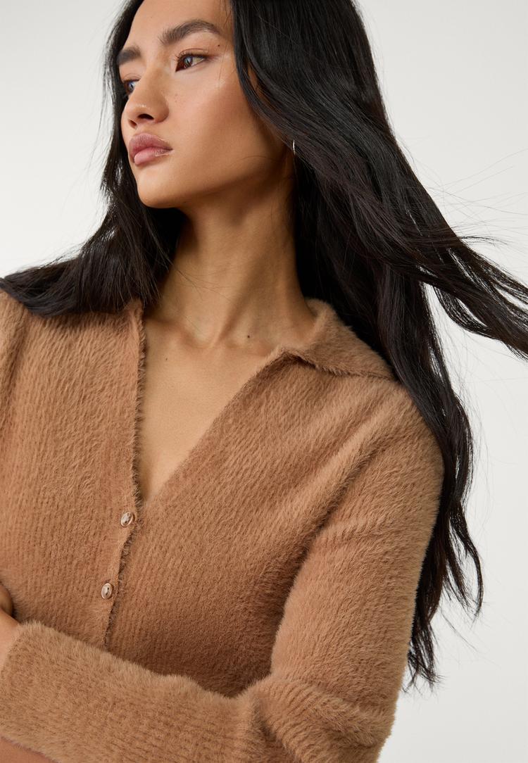veste avec boutons en fausse fourrure