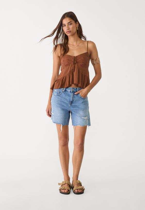 loose fitting ruffled top with embroidery