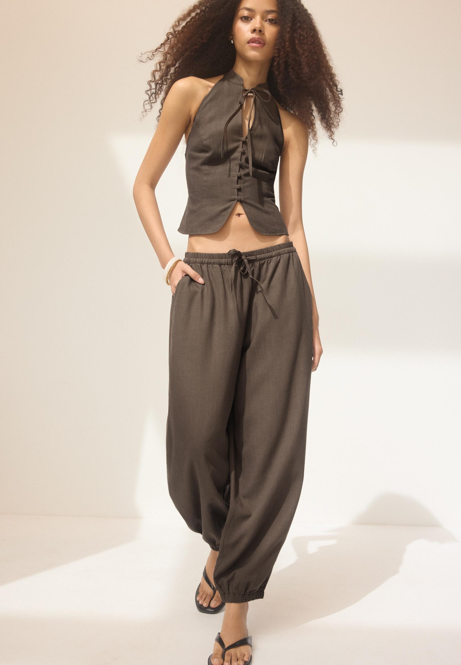 Linen-effect sarouel trousers - Women's fashion | Stradivarius Linen-effect sarouel trousers - Women's fashion | Stradivarius