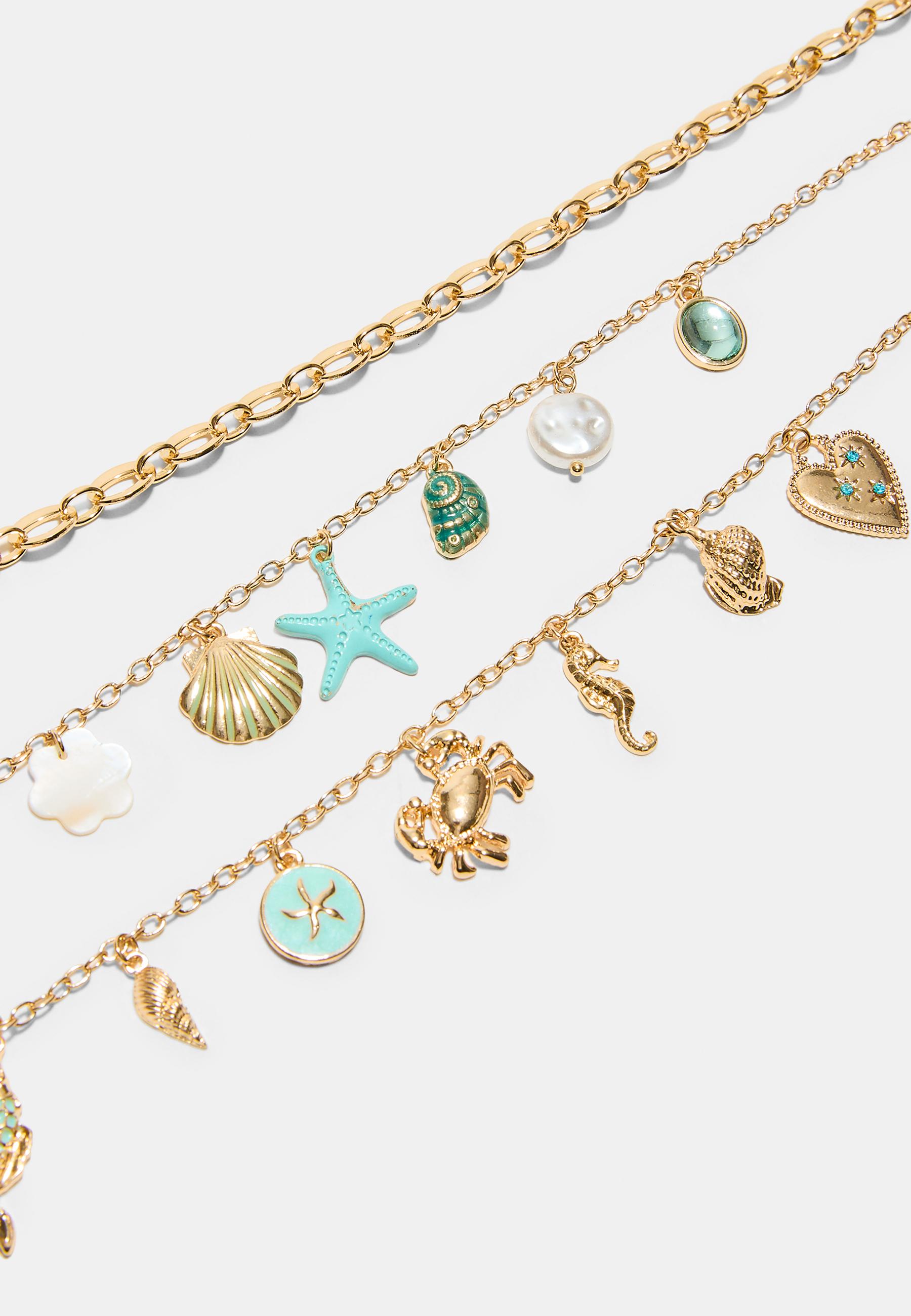 Set of 3 multi-charm sea necklaces — Gold