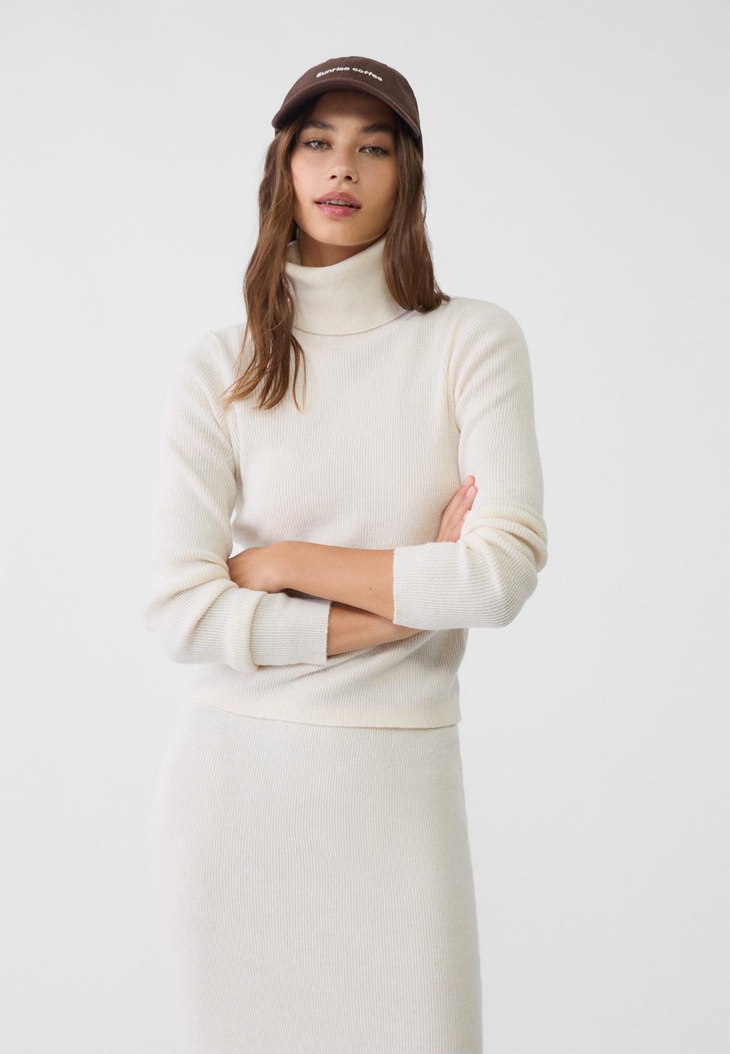 Knit jumper with raised neck