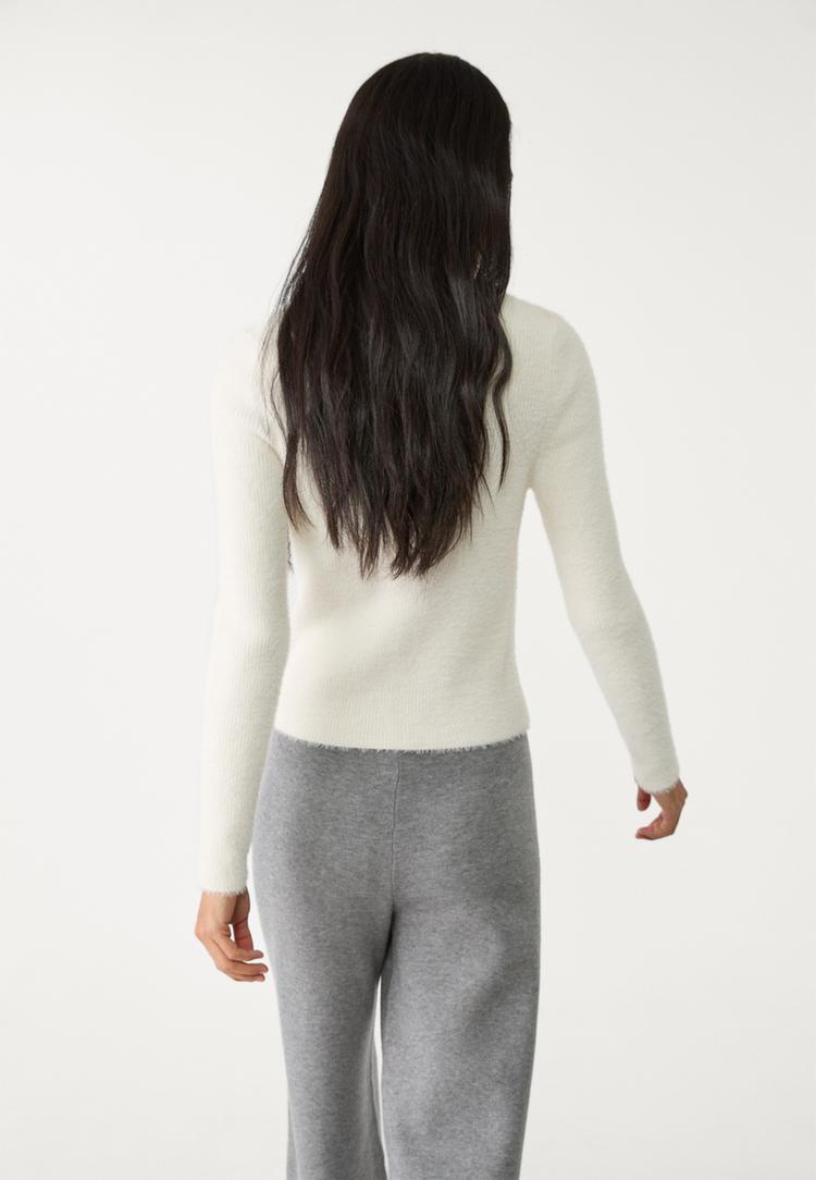 veste avec boutons en fausse fourrure