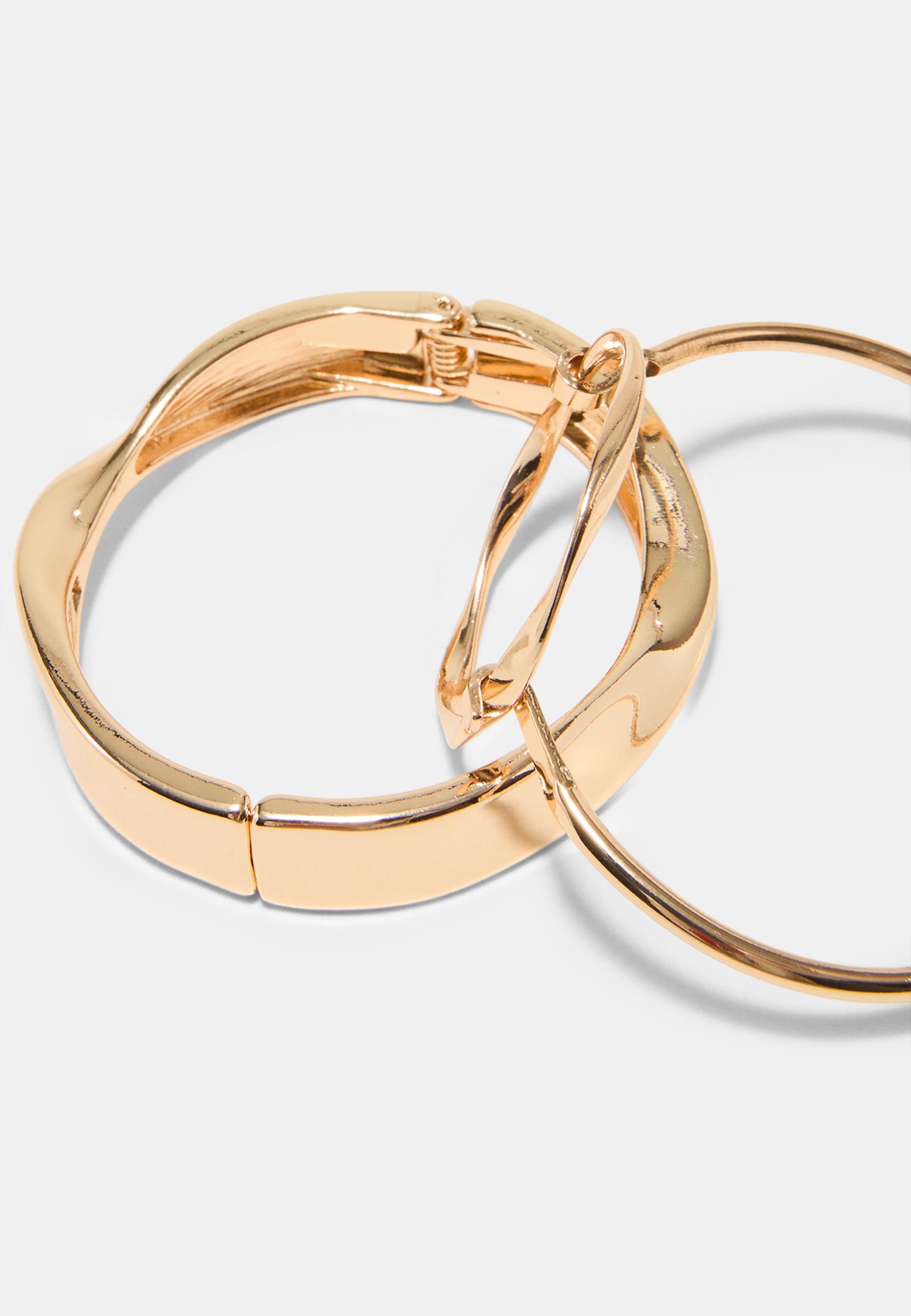 Set of 2 wavy rigid bangles — Gold