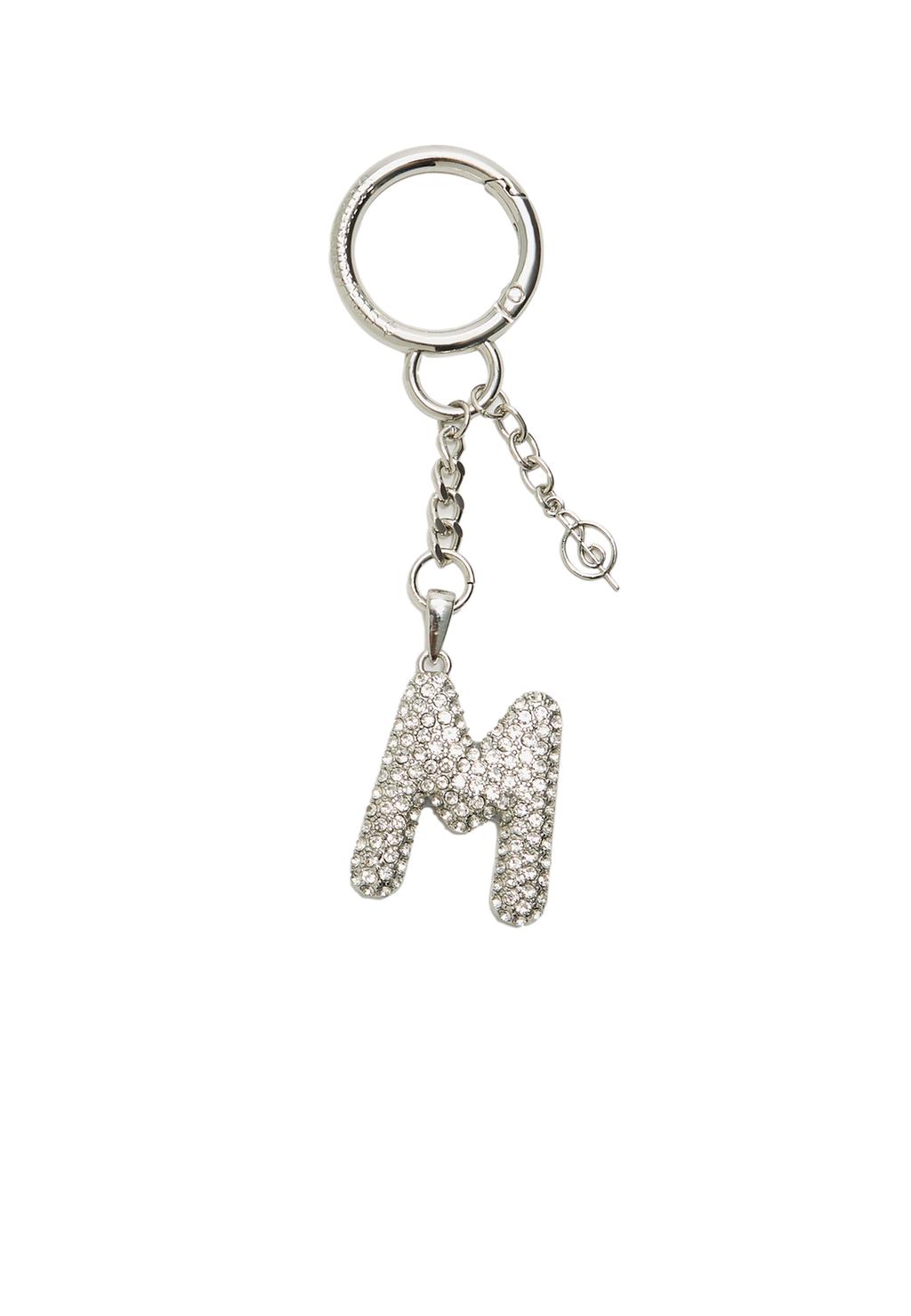 Key ring featuring an initial charm with rhinestones