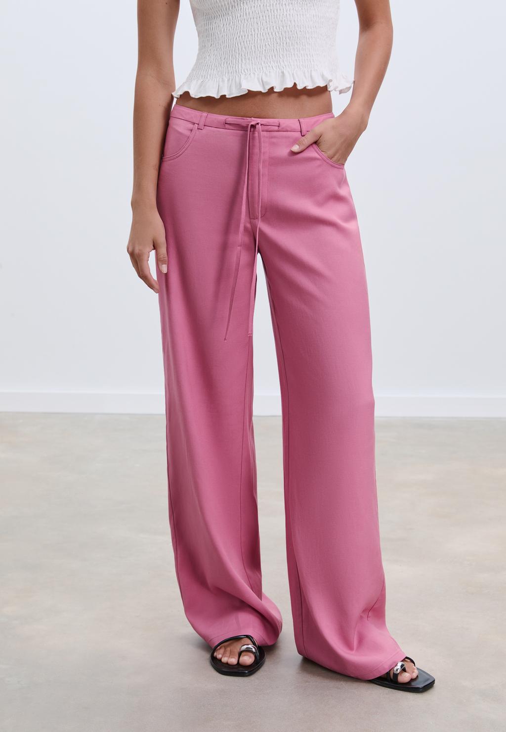 Pantalón fluido bolsillos