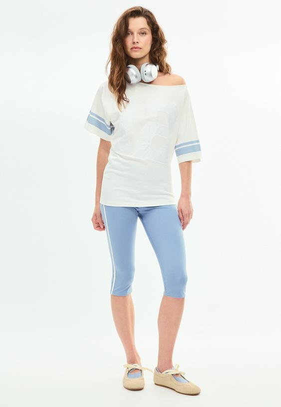 leggings capri com faixas laterais