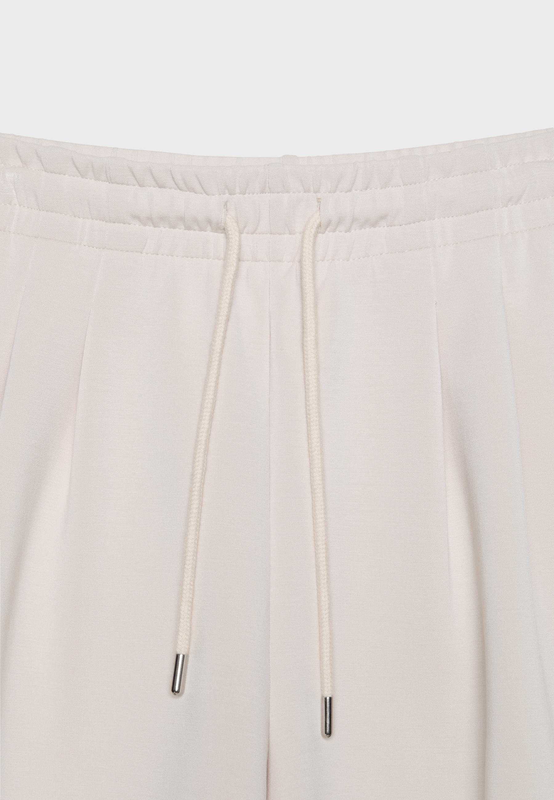 Soft-touch shorts with darts — Stone