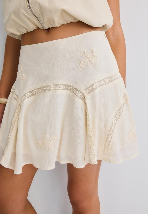 embroidered godet mini skirt