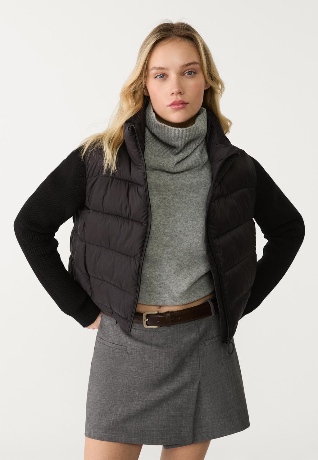 Puffer jacket with chunky knit sleeves