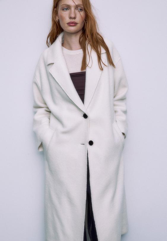 langer-mantel-in-lammfelloptik